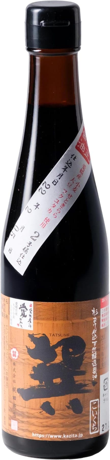 A tall, narrow bottle of dark soy sauce with a diagonal handwritten label, photographed on white