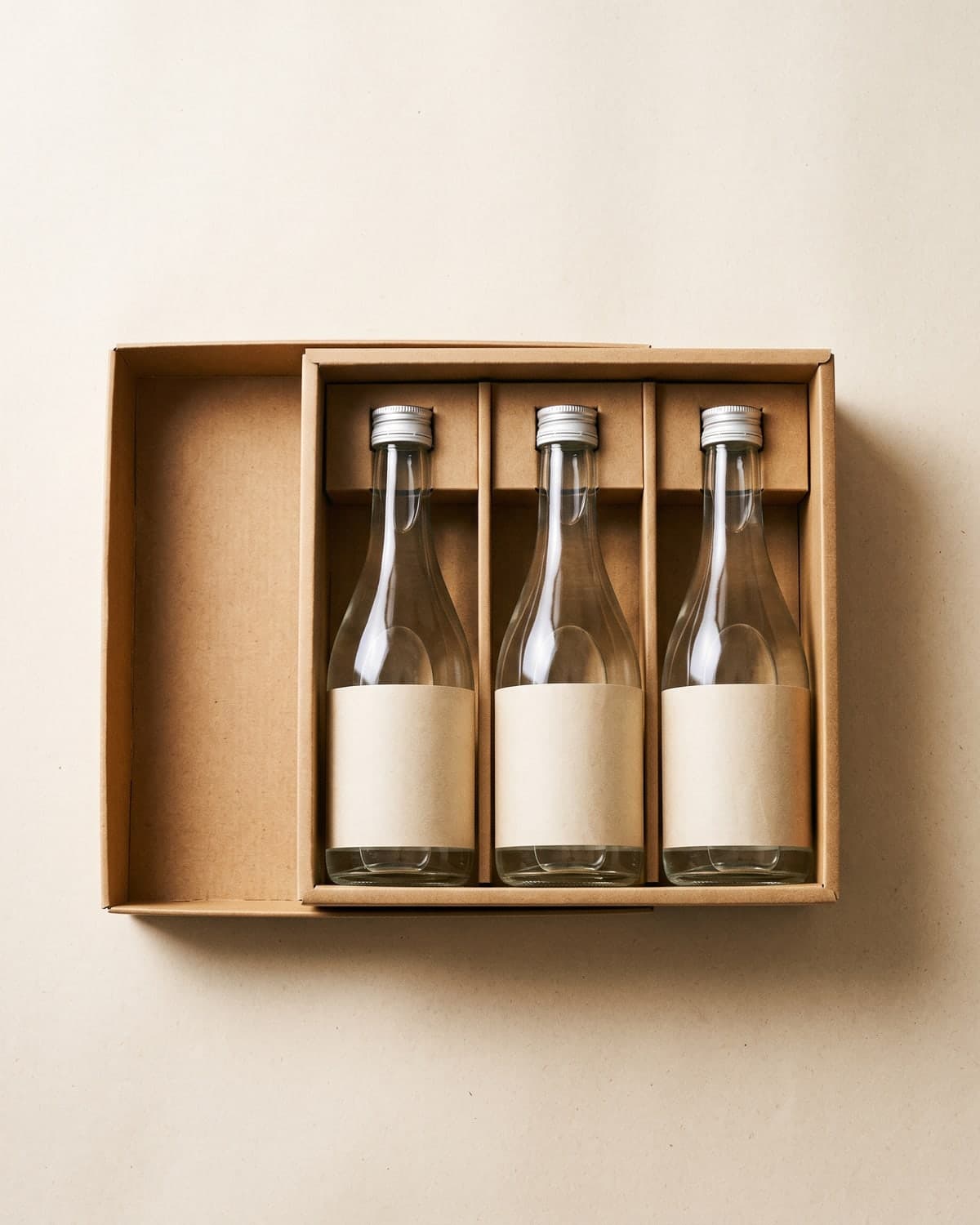 A boxed set of three 300ml sake bottles standing side by side
