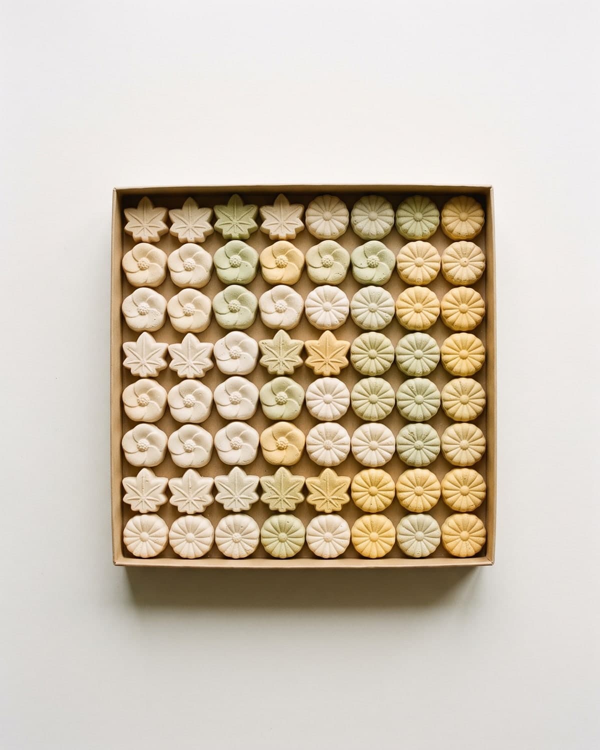 A paper box of wasanbon sugar sweets pressed into seasonal shapes